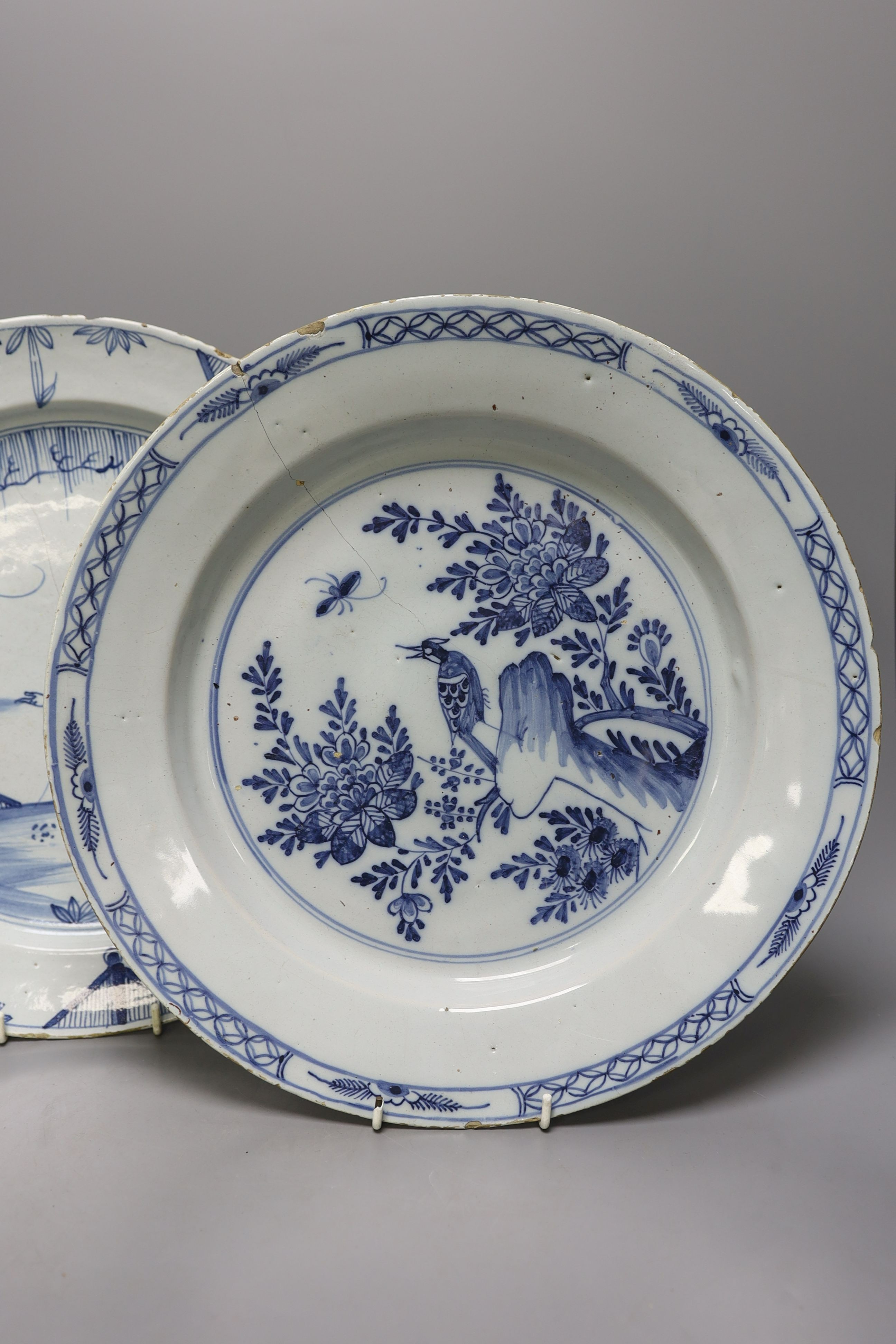 Two 18th century English delftware chargers - 33.5cm diameter